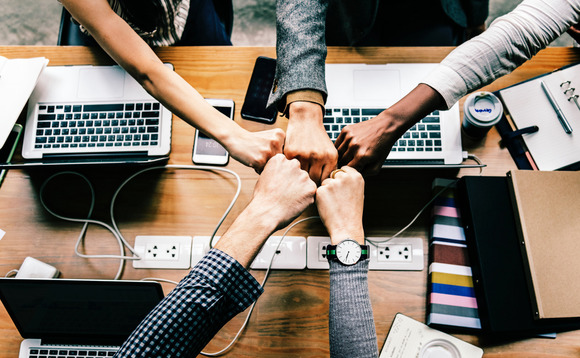 teamwork-women-office-bump teamwork-women-office-bump
