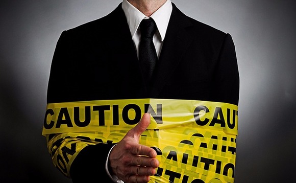 businessman-warning-caution-tape-hazard