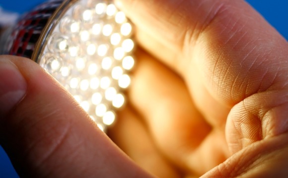 energy-saving-lightbulb-hand energy-saving-lightbulb-hand