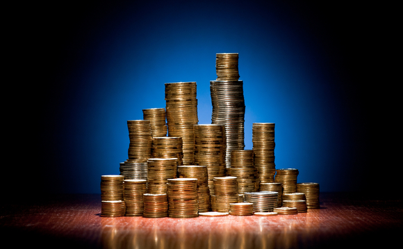 coins-folded-wooden-desk-as-towers-city-26726366