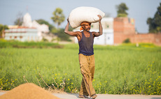 indian-farmer-carrying-bag